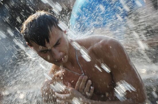 Bathing in fountains at Manezh Square