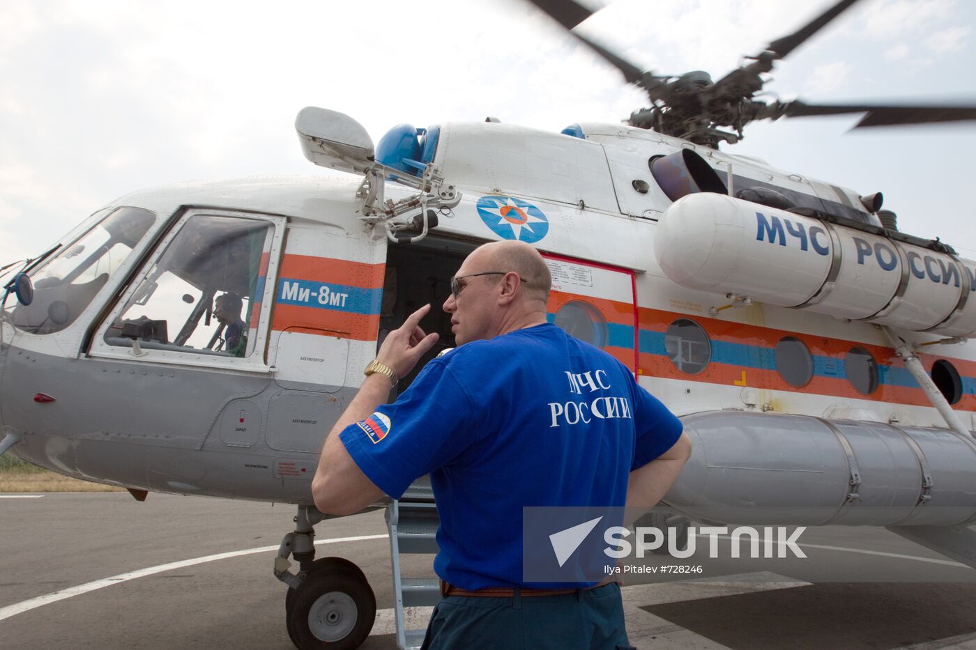 EMERCOM employee near MI-8 helicopter
