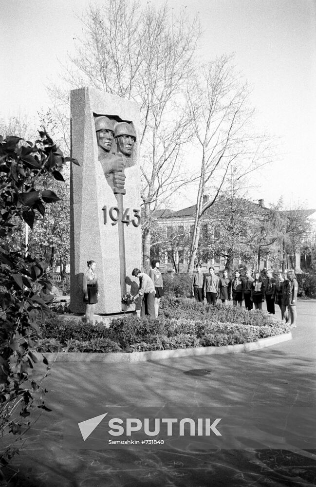 Laying flowers to monument