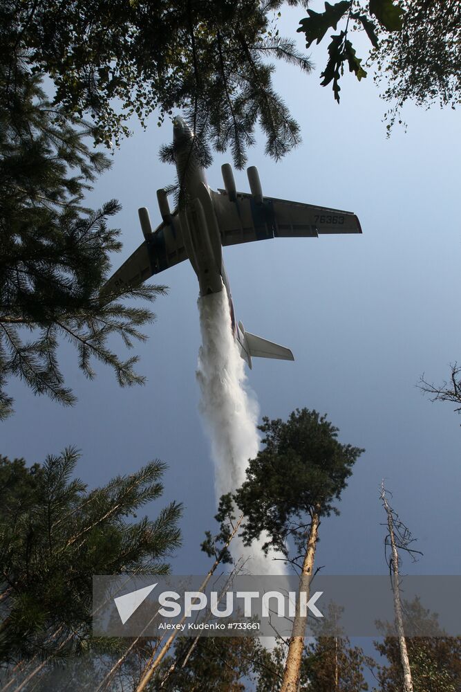 Emergencies Ministry aircraft extinguishing forest fire