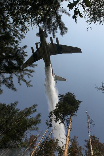 Emergencies Ministry aircraft extinguishing forest fire