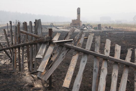 Aftermath of fire in village of Krasny Bakin