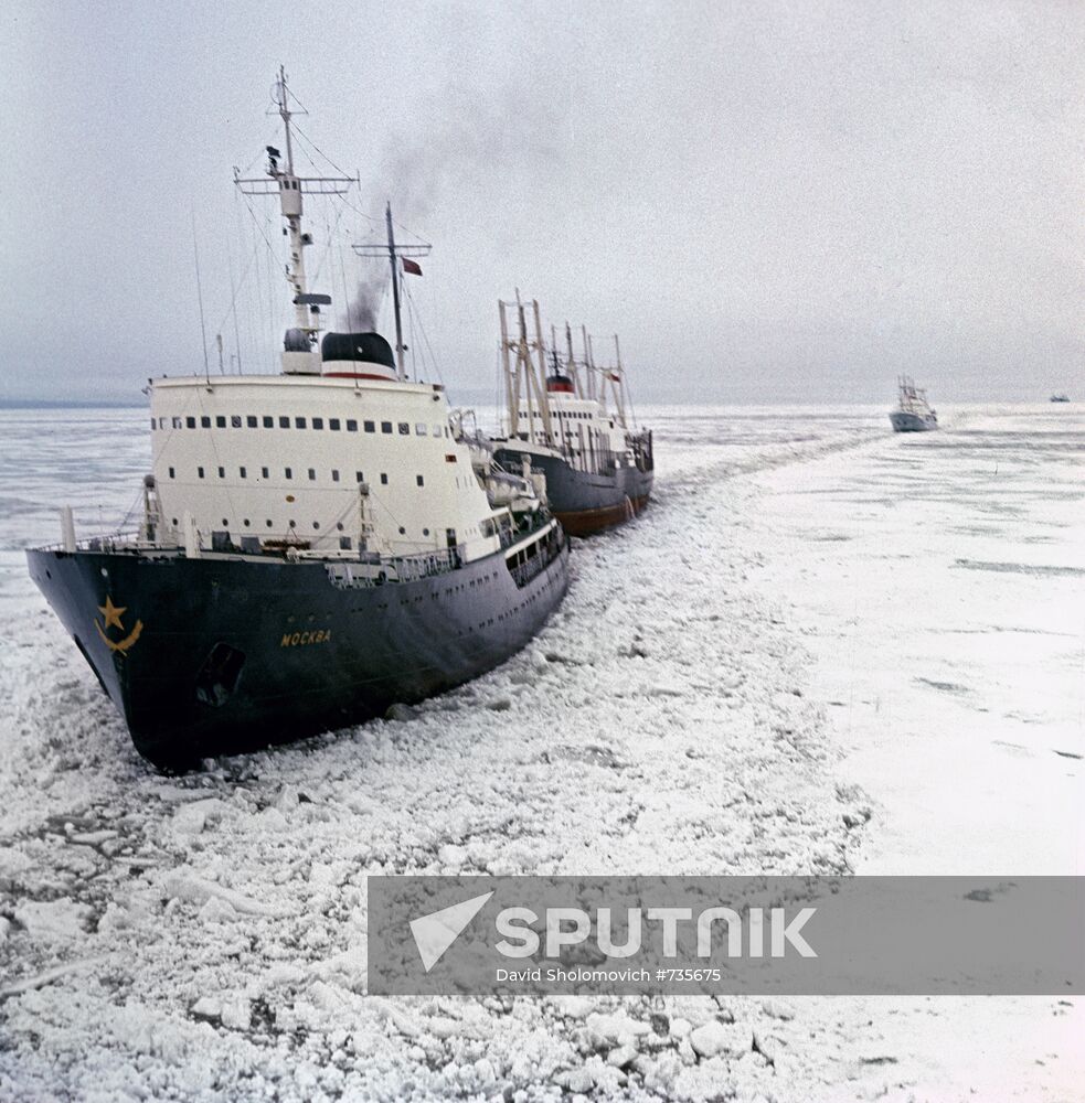 Icebreaker Moscow leading a convoy of ships through Arctic ice