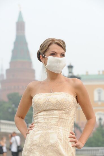 Bride wears mask