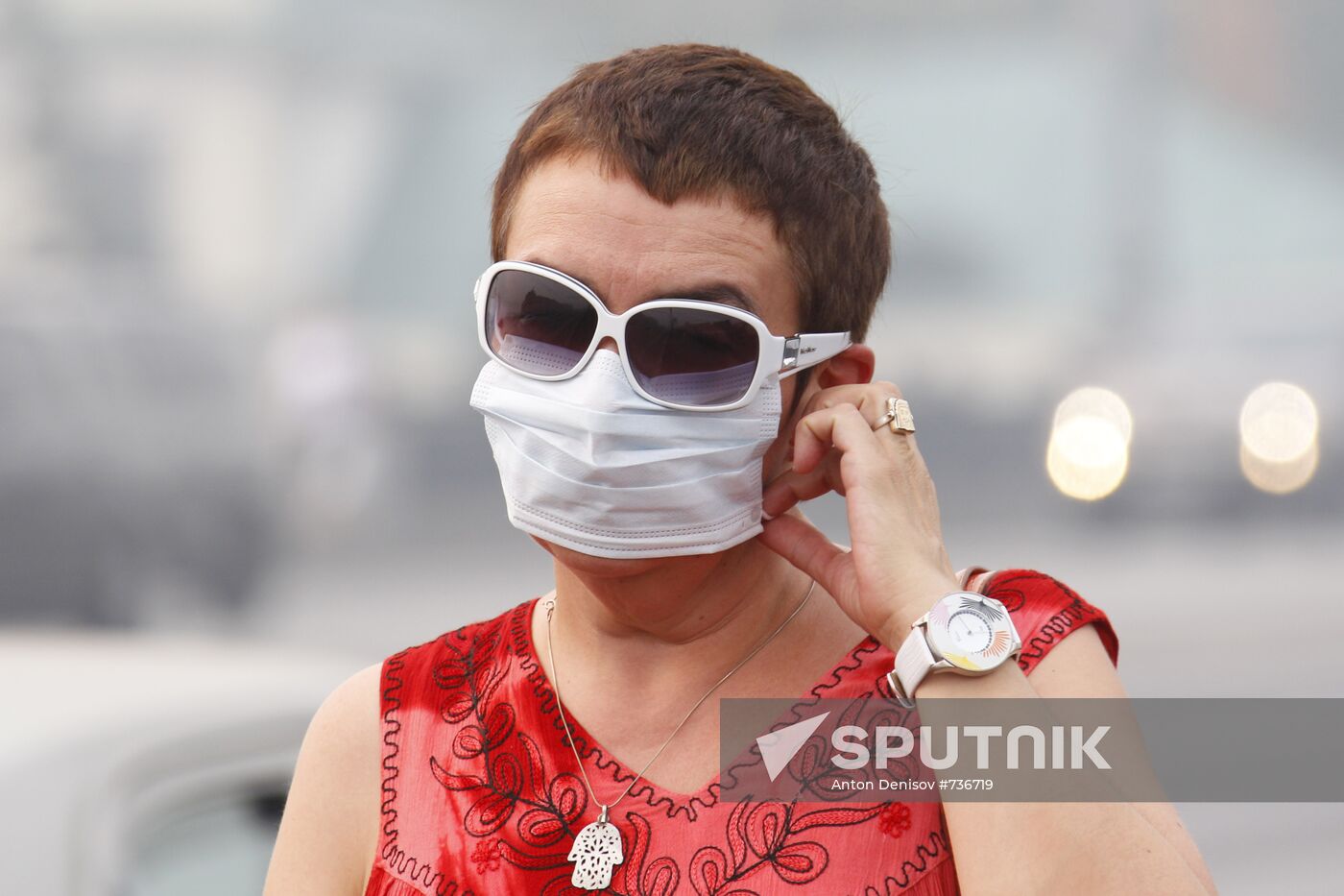 A woman wearing a gas mask