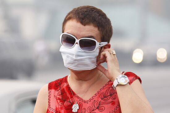 A woman wearing a gas mask