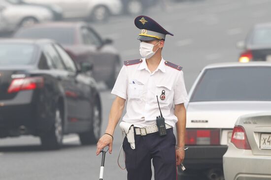 Traffic police officers in gas masks