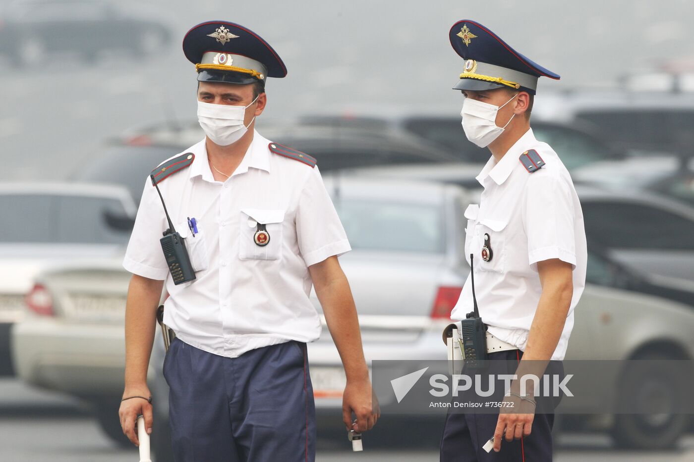 Traffic police officers in gas masks
