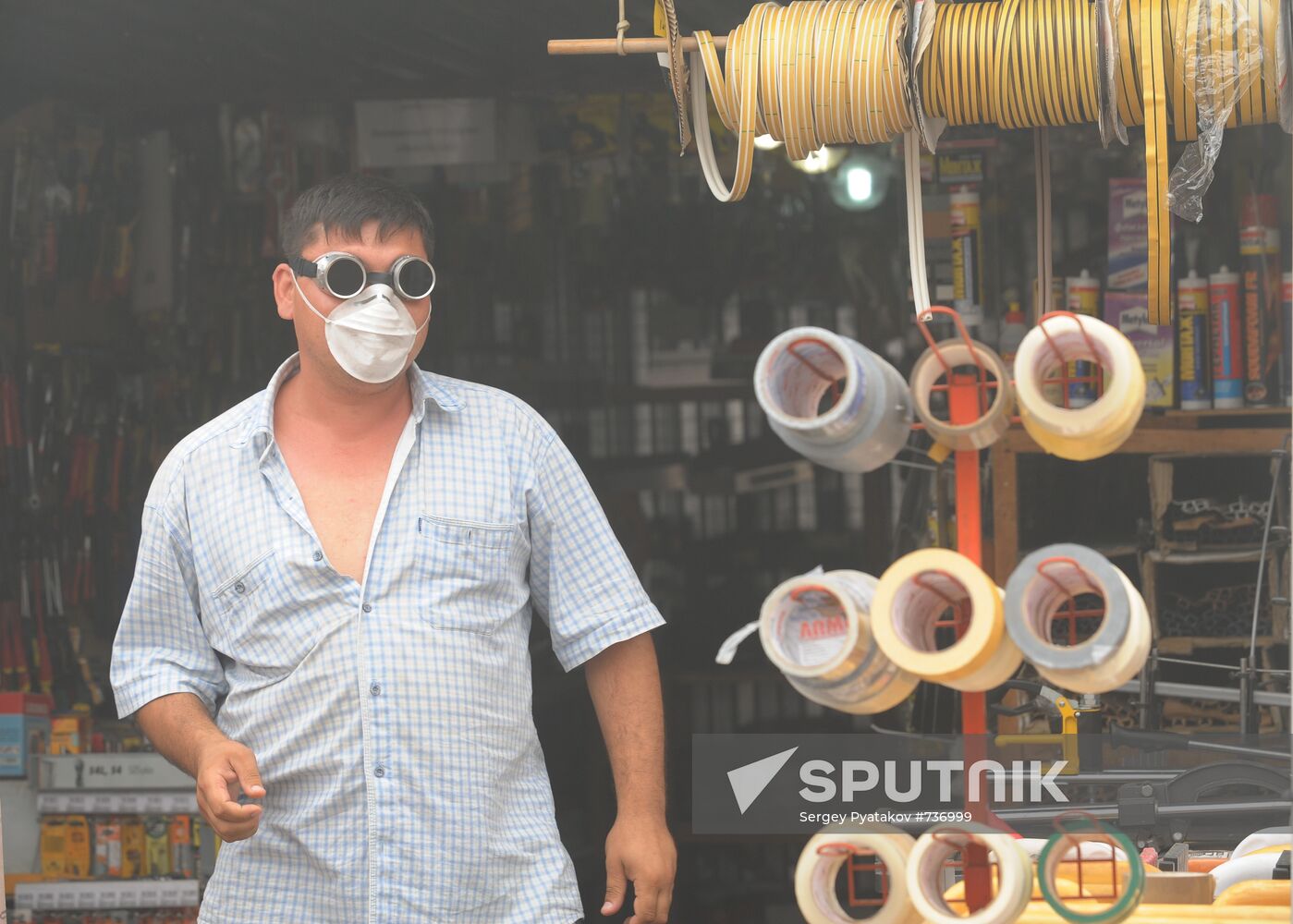 Marketplace vendor wearing a mask