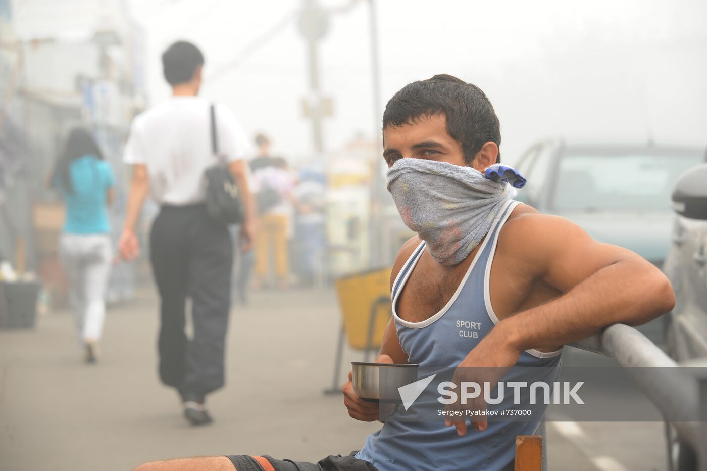 City resident in gas mask