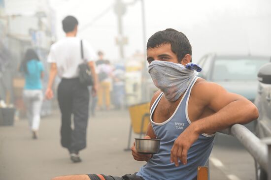City resident in gas mask