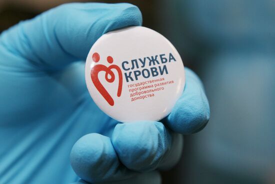 Badge with Sluzhba Krovi (Blood Service) logo