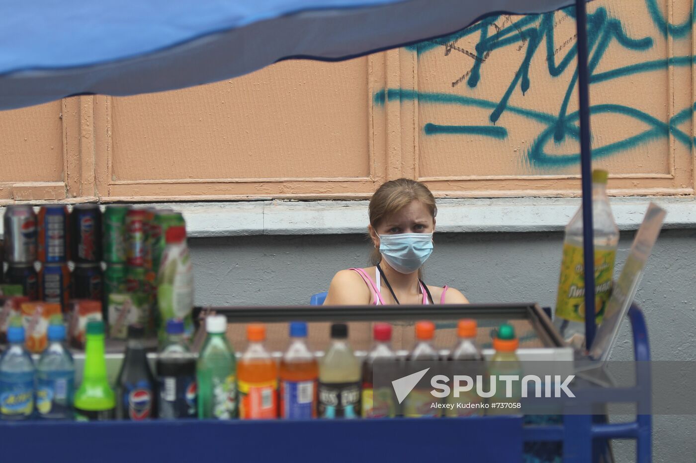 Drinks seller in protective mask
