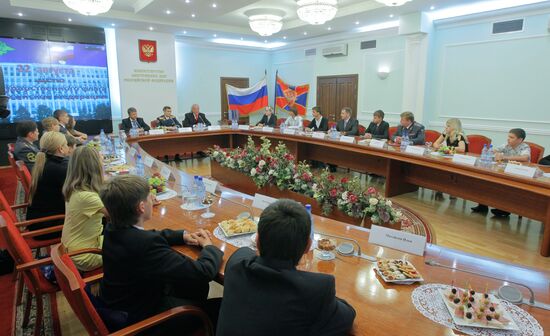 Interior Minister Rashid Nurgaliyev presents IDs to teenages