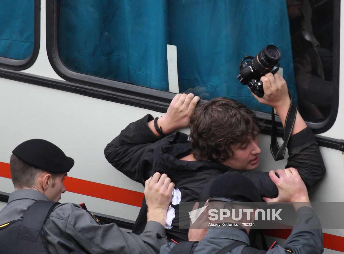 Law enforcement officers deter photojournalist