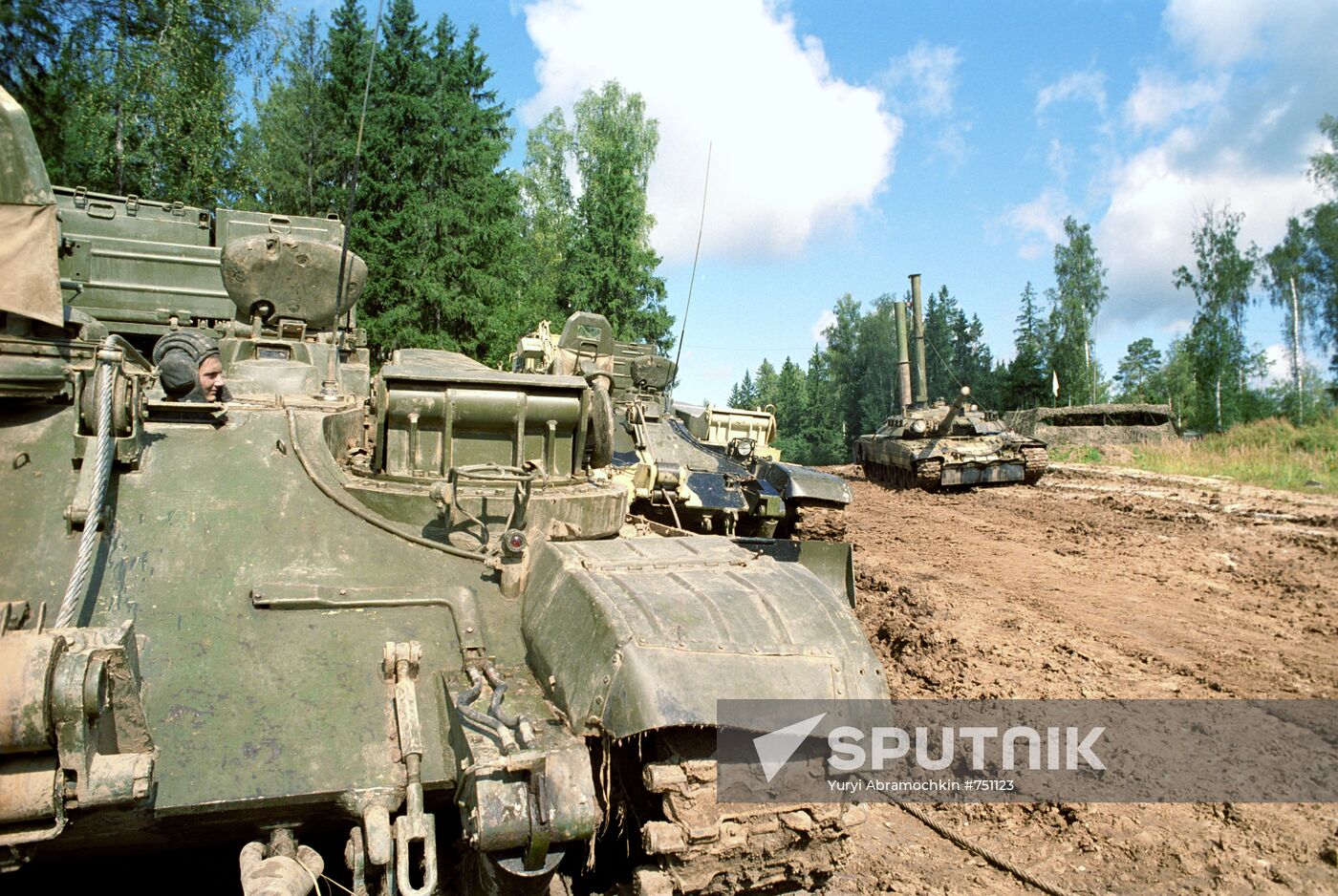 Tanks T-80 cross a lake in the course of exercise