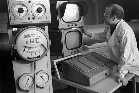 Engineer Igor Gusev monitoring generator's operation