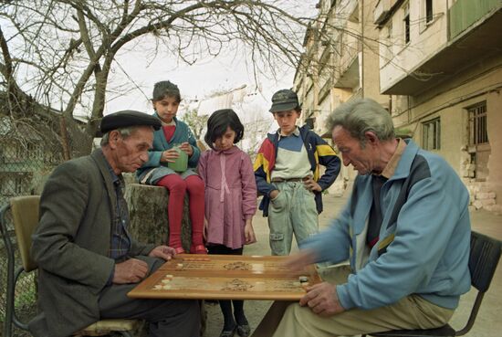 Yerevan yard. Playing backgammon
