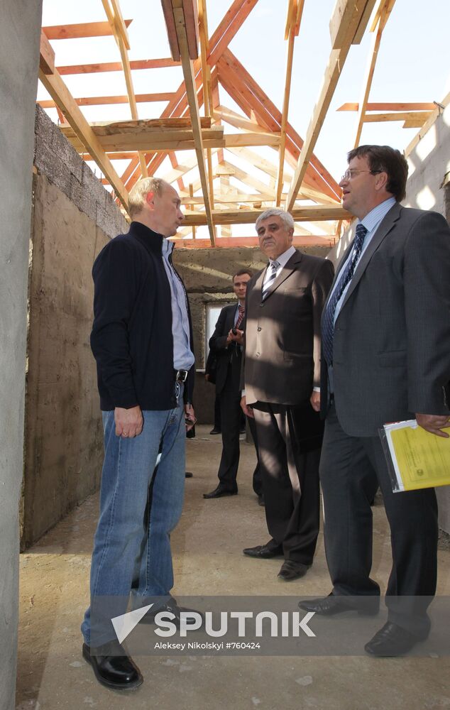 September 15, 2010. Russian Prime Minister Vladimir Putin (left) visiting Ivatino village (Melenkov district). Having inspected the course of construction of houses for those affected by the wildfires. Vladimir Region Governor Vladimir Vinogradov (background, center). Location: Russia, Vladimir Region. Author: Aleksey Nikolskyi/Sputnik. Russian Prime Minister Vladimir Putin visits Ivatino village