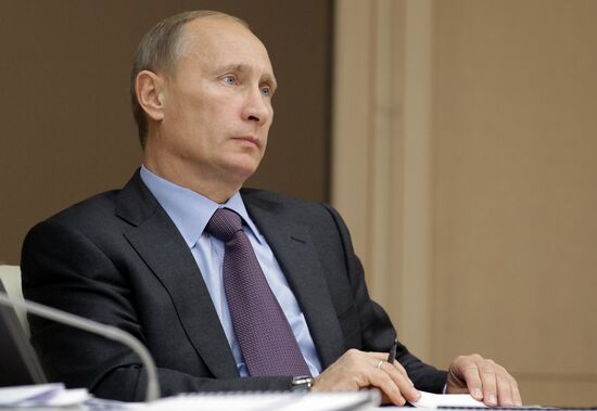 Vladimir Putin conducts a teleconference