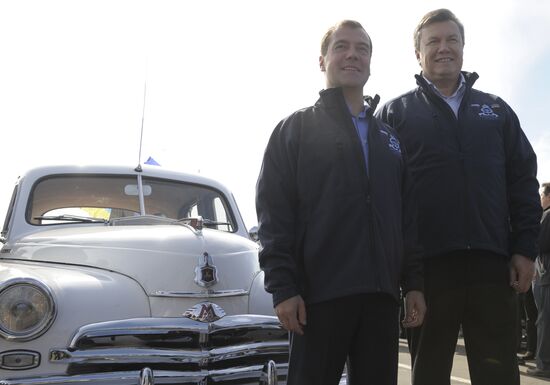 Dmitry Medvedev and Viktor Yanukovich take part in motor race