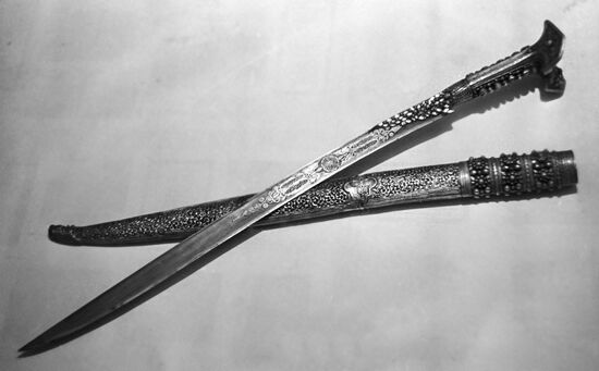 Damask steel saber with an embossed ornament