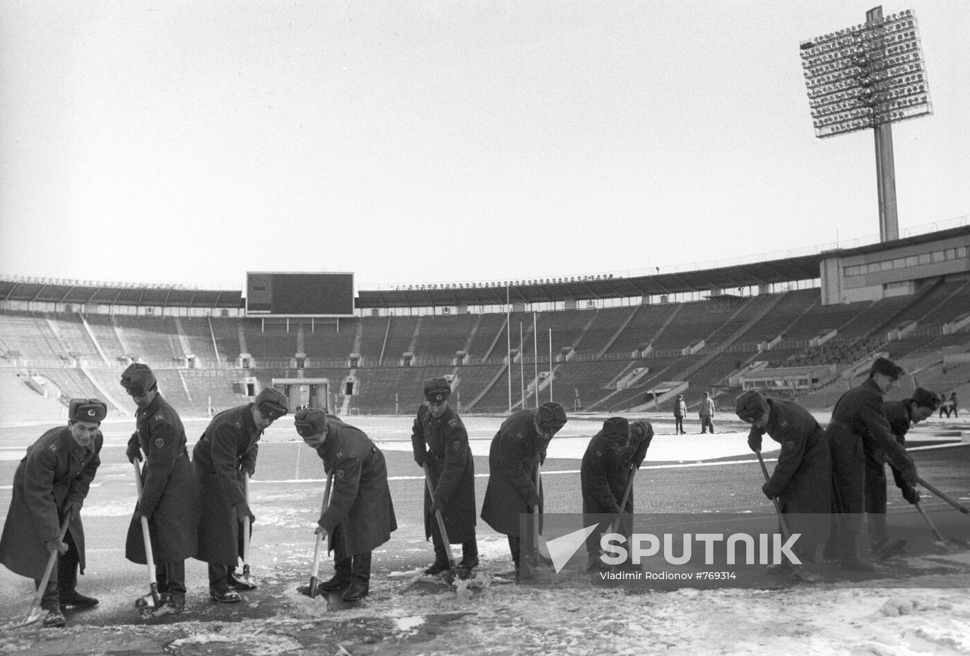 Cleaning stadium of snow