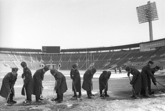 Cleaning stadium of snow