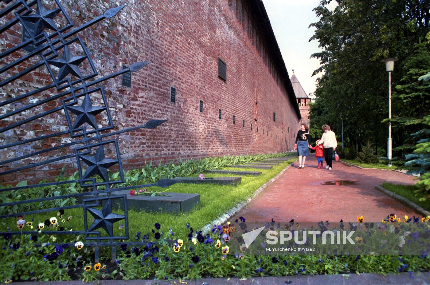 Graves of Soviet soldiers by old fortress wall