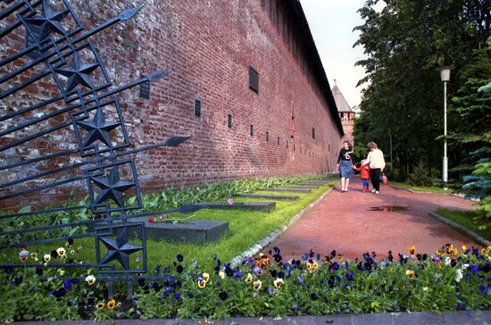 Graves of Soviet soldiers by old fortress wall