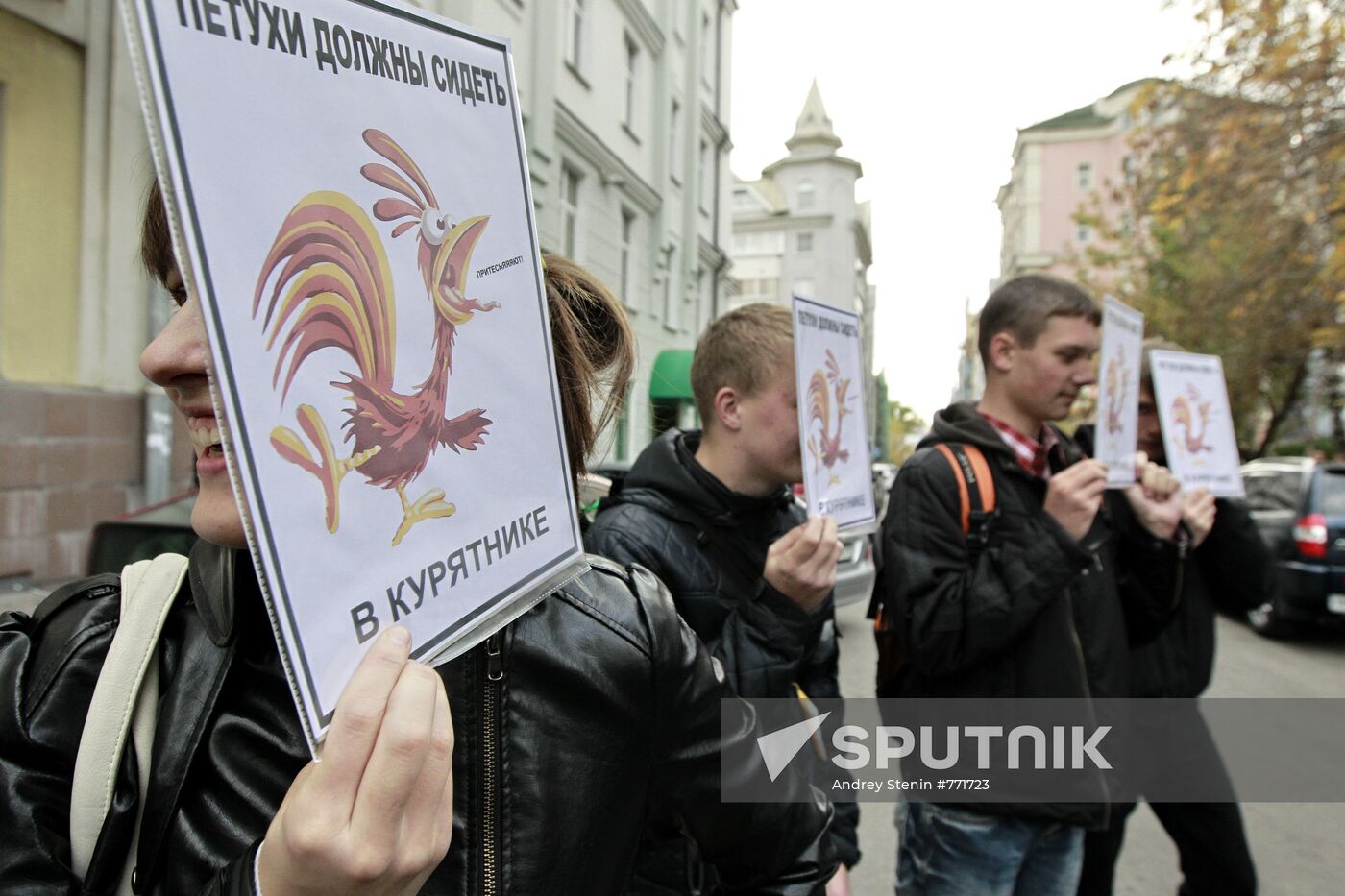 Young people holding posters