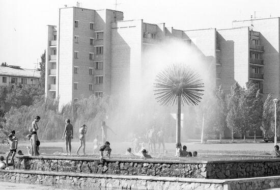 Children bathing in a fountain