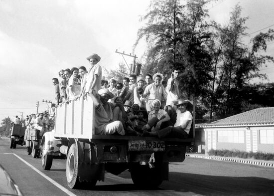 Workers of Havana enterprises going to harvest sugarcane
