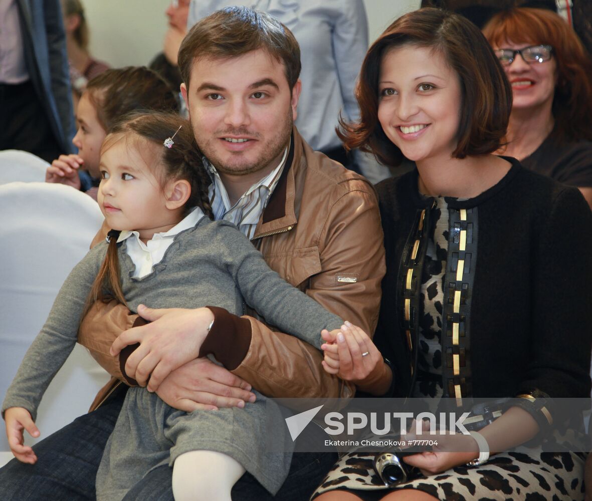 Yana Batyrshina with her husband and daughter