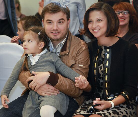 Yana Batyrshina with her husband and daughter