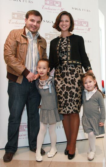 Yana Batyrshina with her husband and daughter