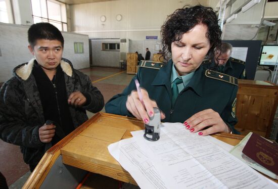 A Chinese national go through customs