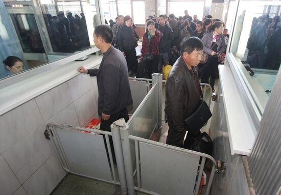 Chinese nationals go through passport control