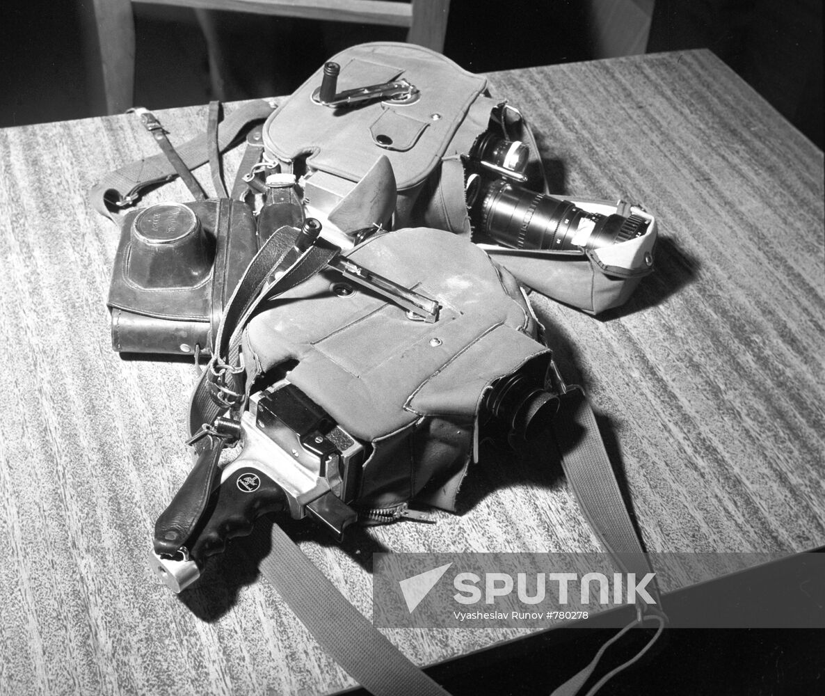 Two Bolex cameras and still camera