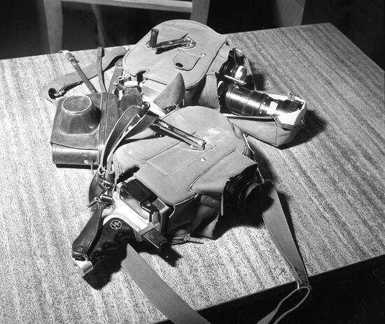Two Bolex cameras and still camera