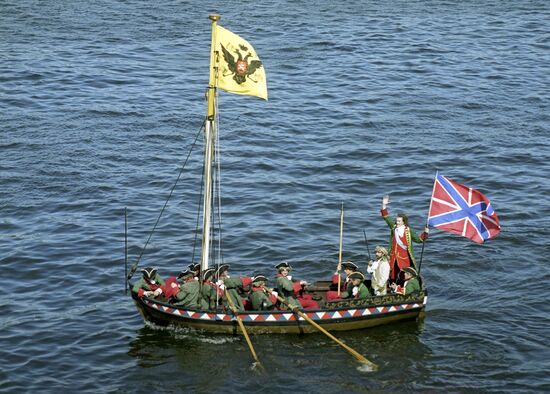 Participants of theatrical show on Neva-river