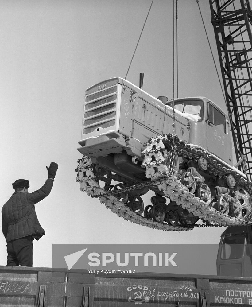 Loading a DT-75-M Kazakhstan tractor