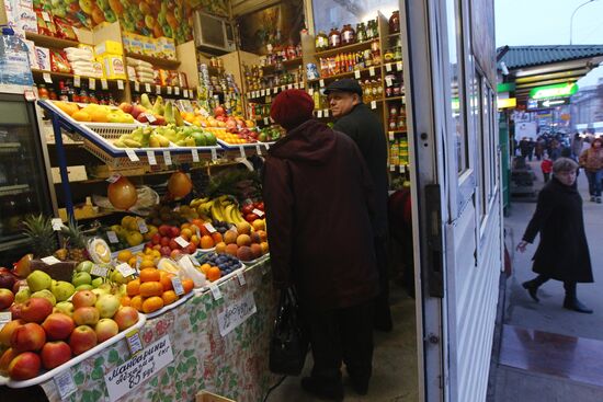 Visitors choosing goods at a kiosk