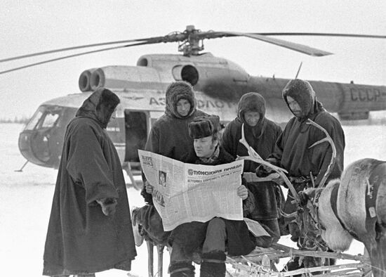 Reindeer breeders helicopter newspaper