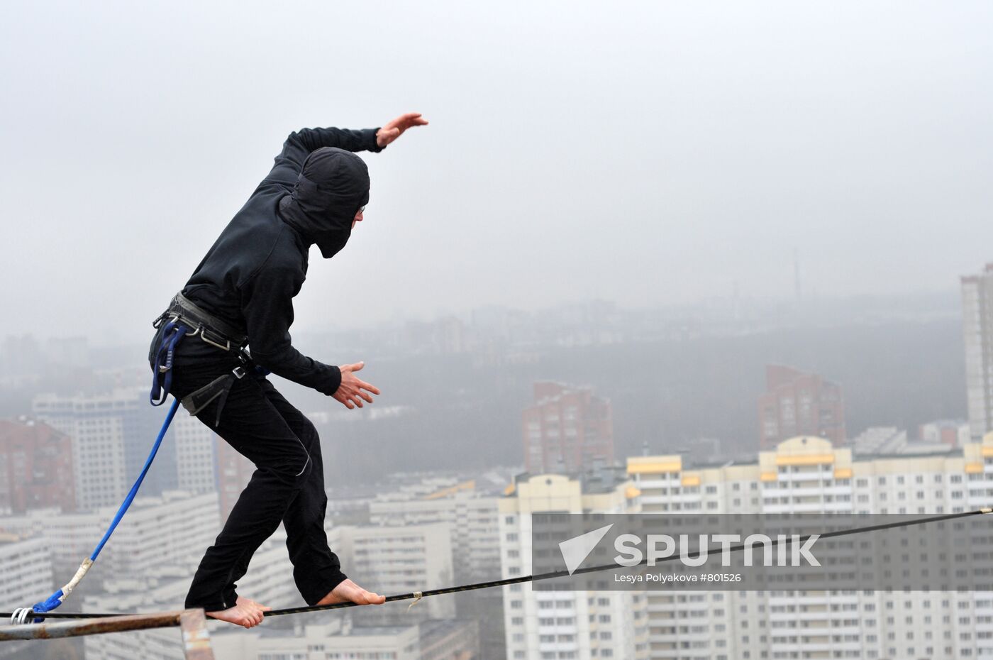 Athletes walk on wire rigged 25 meters above ground