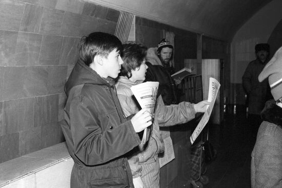 Teenagers selling newspapers
