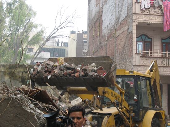 Apartment building collapses in New Delhi