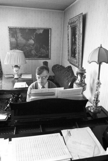 Composer Raimonds Pauls working at home