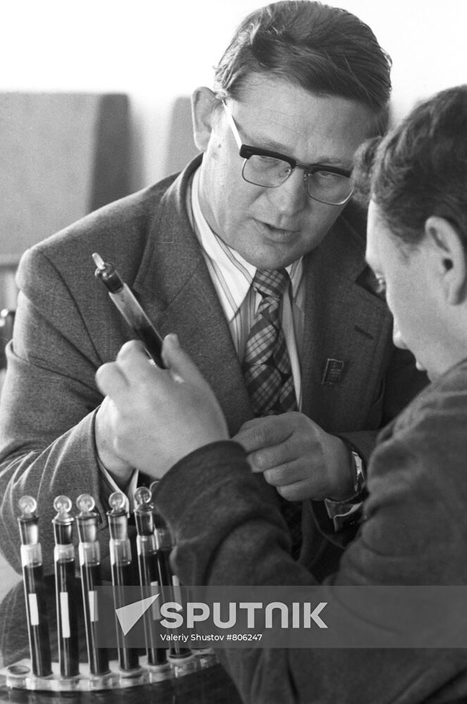 O.Gusev examining oil samples