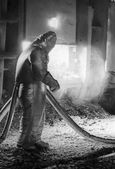 Worker in heat protective suit
